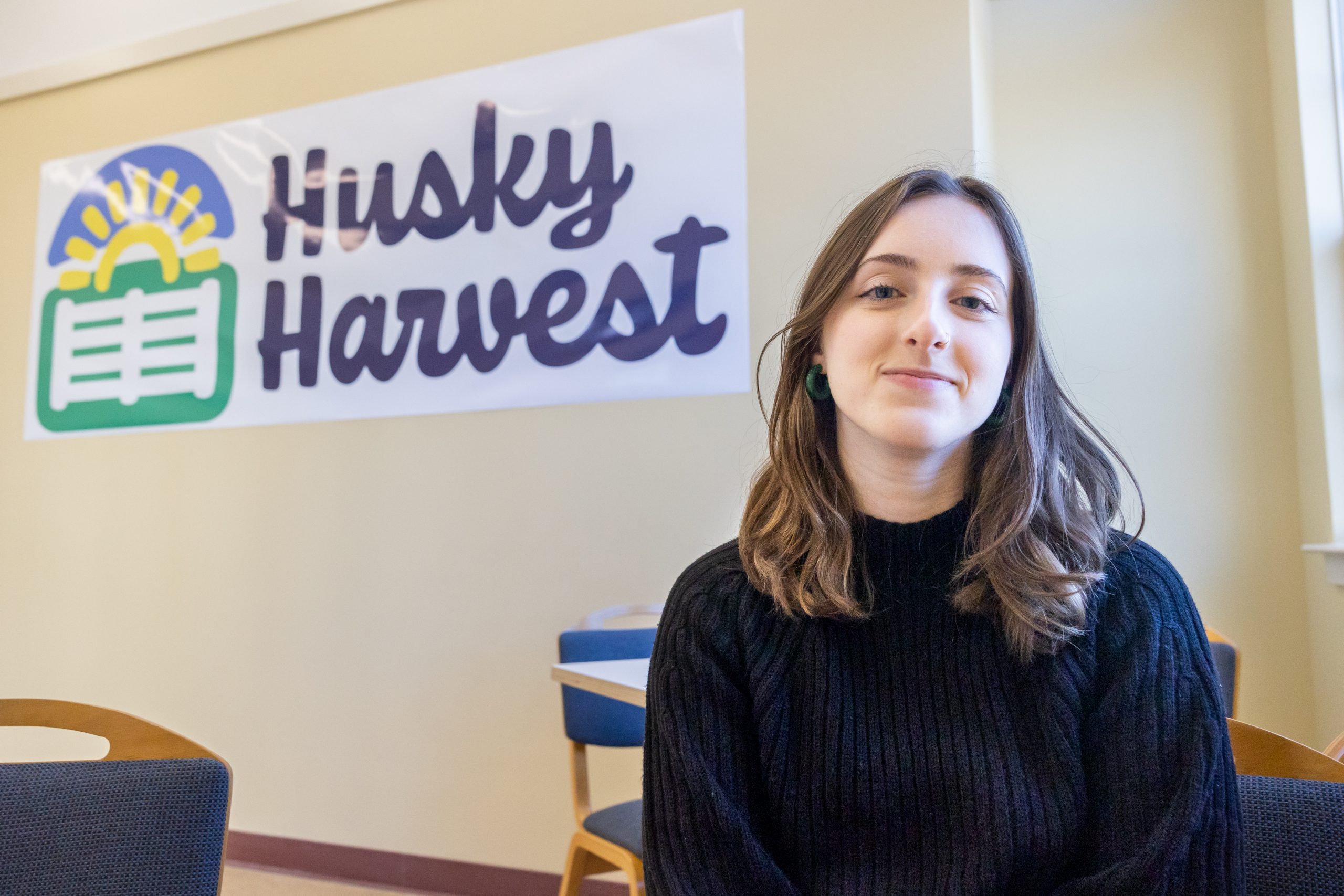 Upcoming UConn graduate Lily Forand poses for a photo in the Husky Harvest space in Storrs on March 30, 2023. Forand, who is currently the food insecurity coordinator for the Undergraduate Student Government, helped organize a pop-up food pantry in the Student Union earlier this school year and was instrumental in the creation of Husky Harvest at Storrs. (Sydney Herdle/UConn Photo)