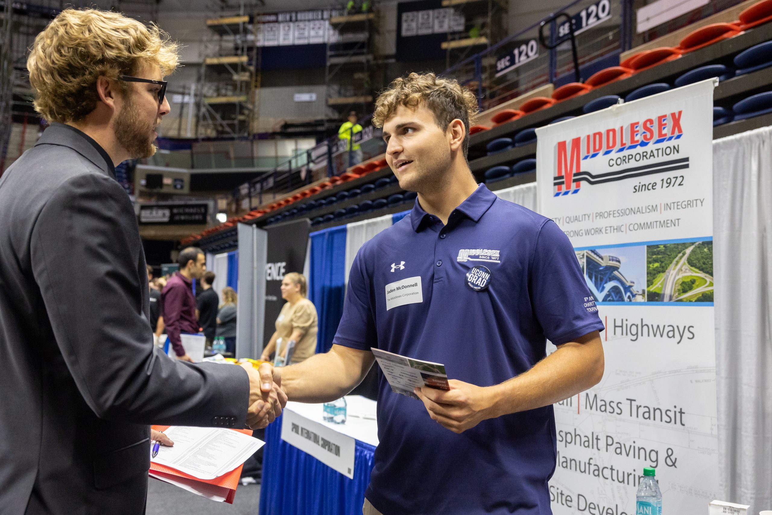 UConn students and company recruiters interact at the Fall Career Fair in Gampel Pavilion on Sept. 17, 2024. (Sydney Herdle/UConn Photo)
