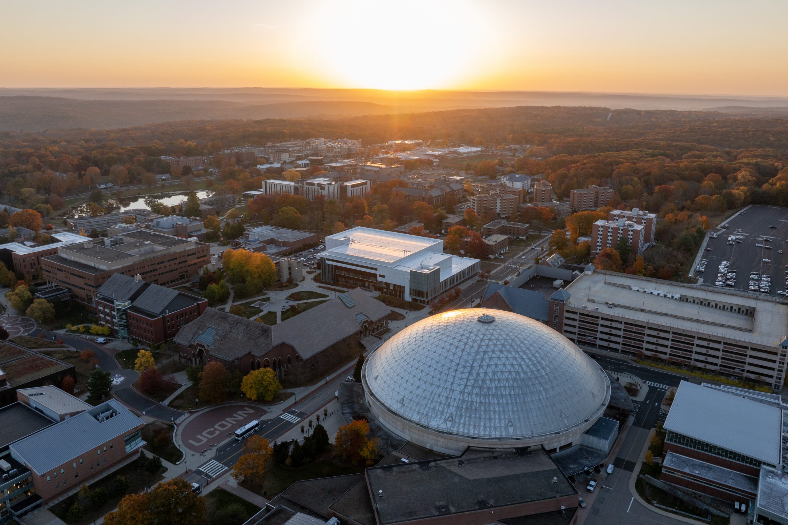 An aerial view of the UConn Storrs campus at sunrise as the leaves change color on Oct. 22, 2024. (Sydney Herdle/UConn Photo)