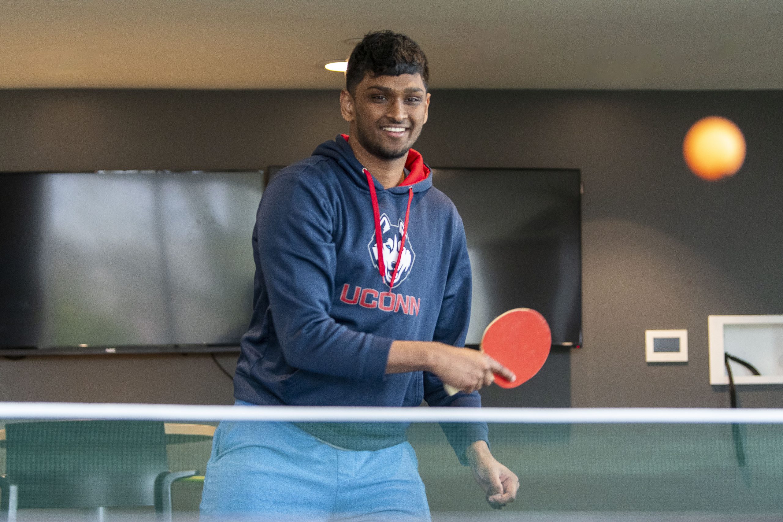 Student playing pingpong at Avery Point on April 18, 2024. (Sean Flynn/UConn Photo)