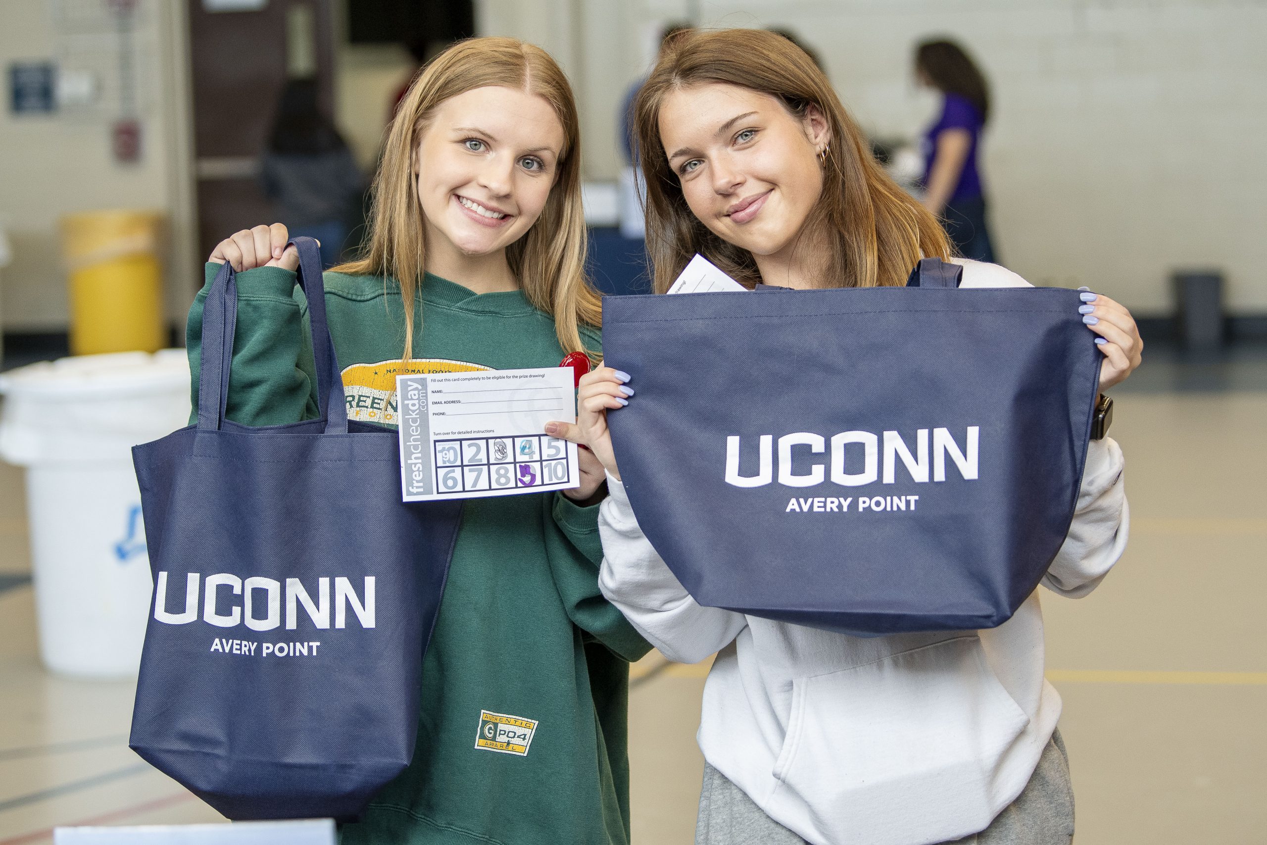 Avery Point students holding branded bags on April 18, 2024. (Sean Flynn/UConn Photo)