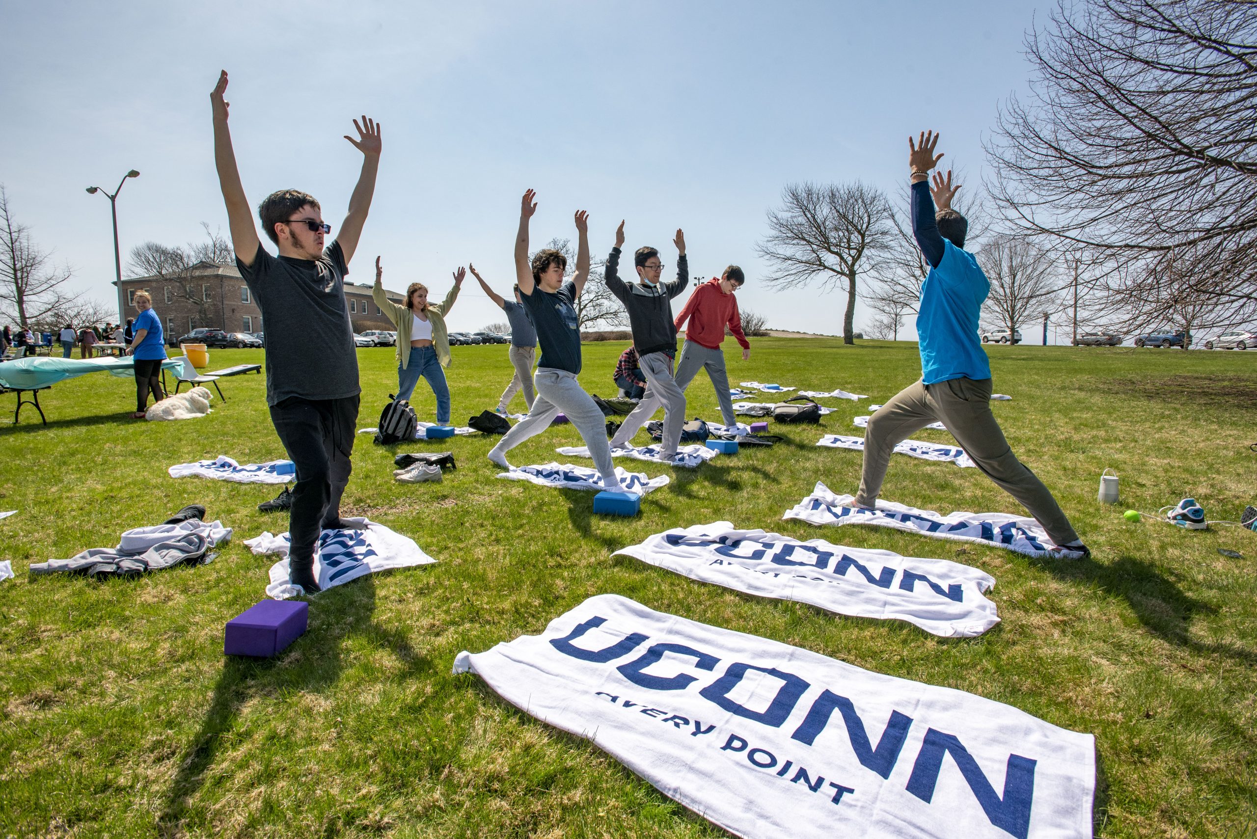 Students at the UConn Avery Point campus doing Yoga outside. April 14, 2022. (Sean Flynn)