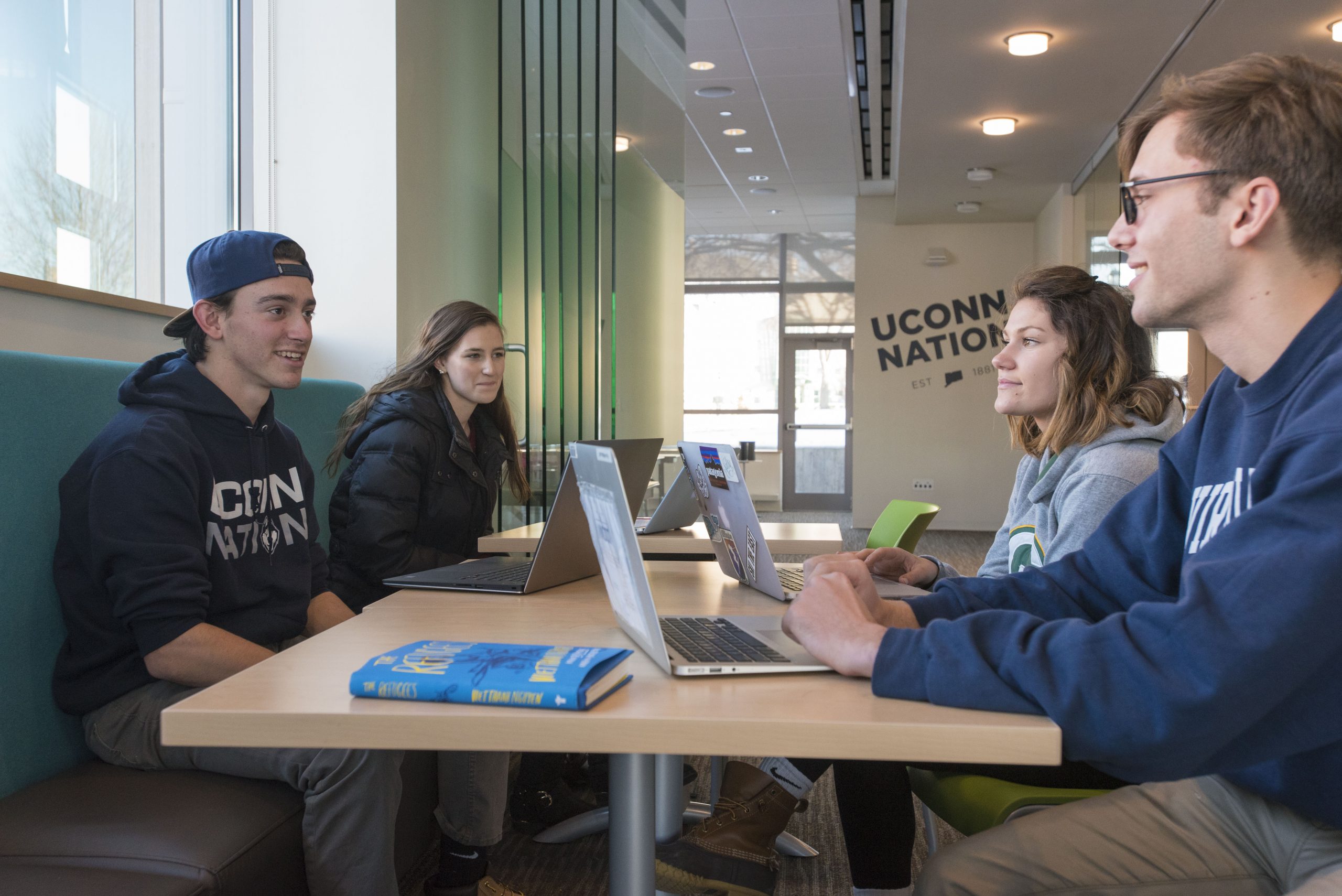 Students talking in the Student Center at UConn Avery Point  on Dec. 14, 2017. (Sean Flynn/UConn Photo)