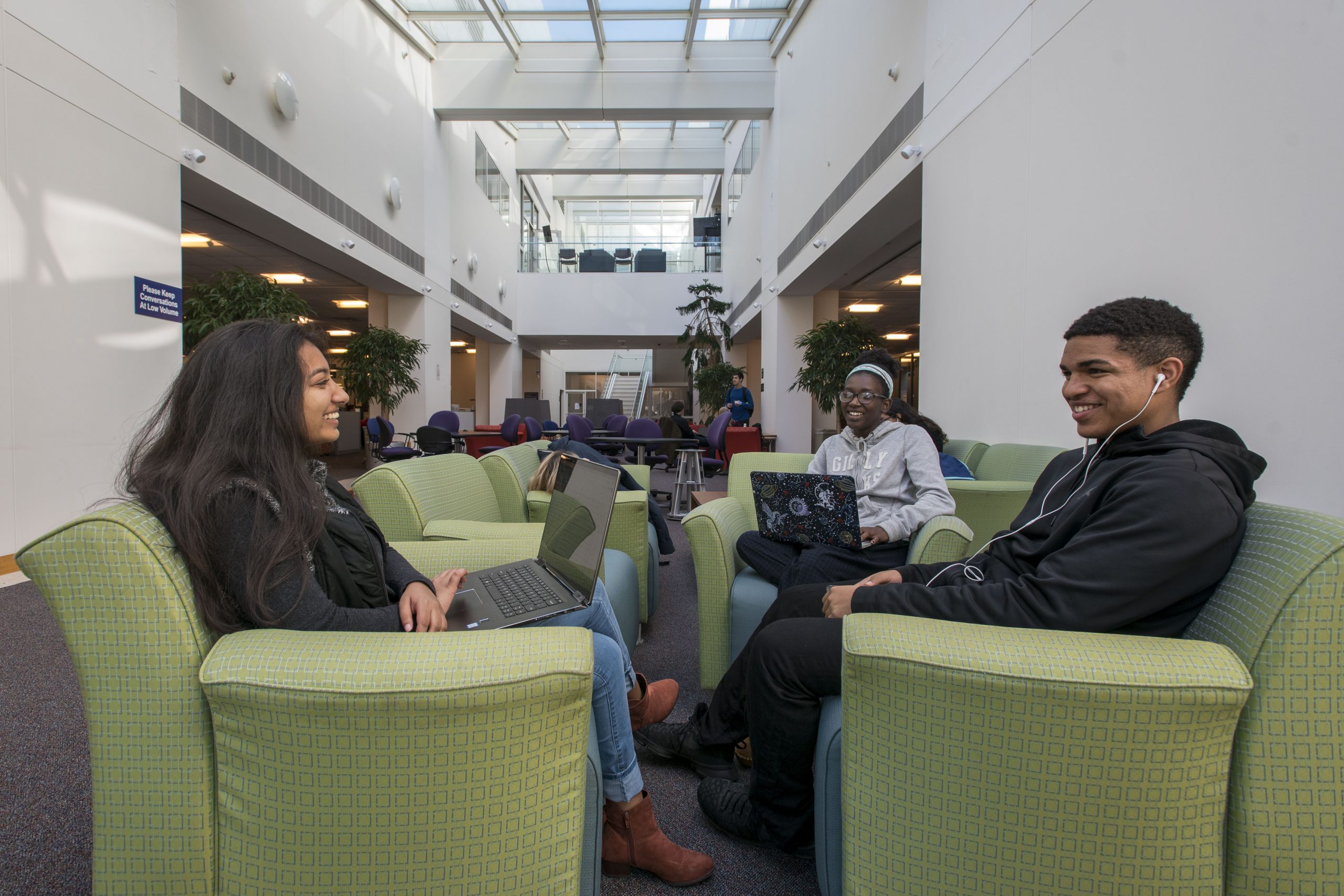 talking181017a153.jpg Students socializing in the library at Uconn Stamford on Oct. 17, 2018. (Sean Flynn/UConn Photo)