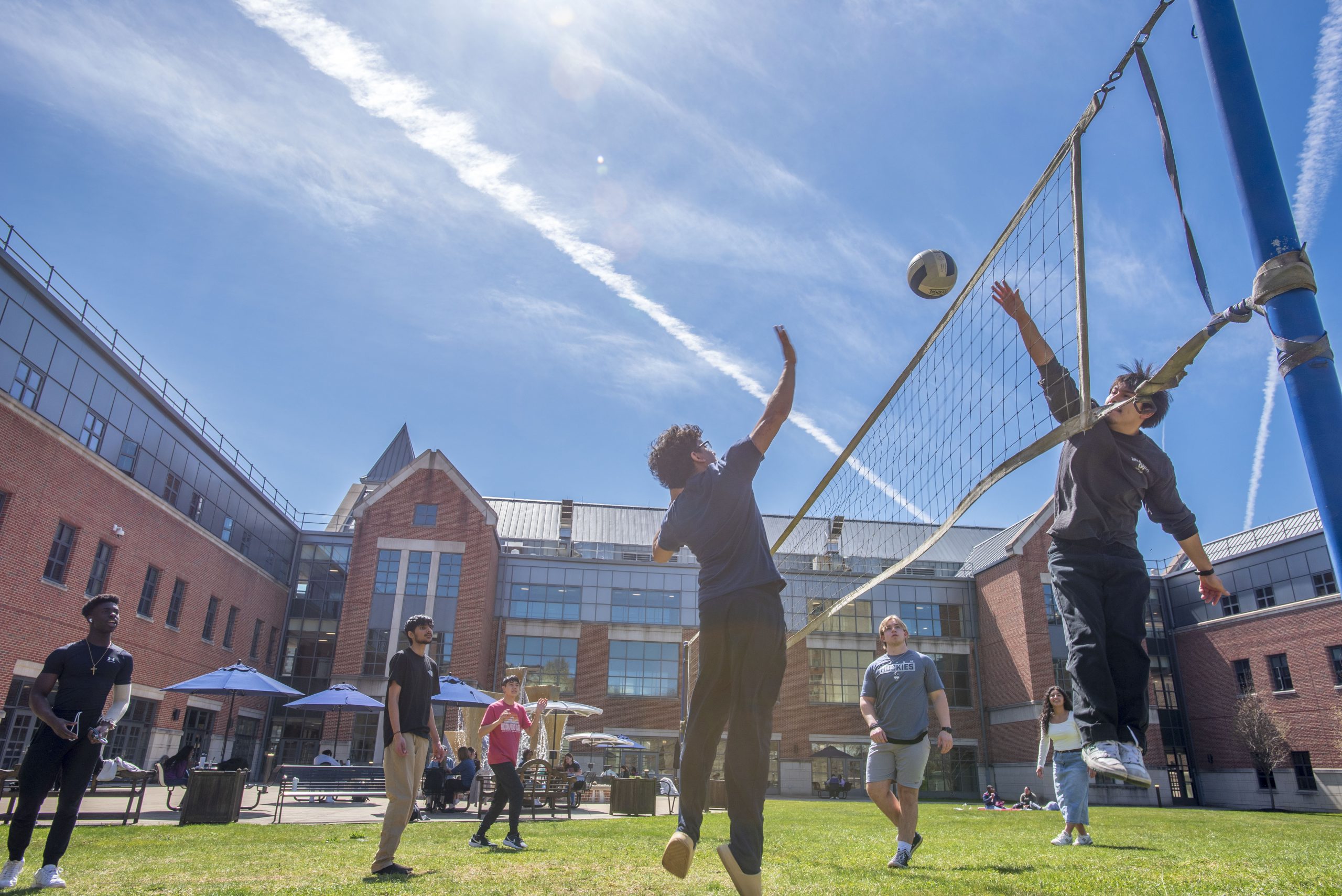 waterbury-volleyball-240409b0289.jpg Students playing volleyball outdoors in the courtyard at UConn Waterbury on April 9, 2024. (Sean Flynn/UConn Photo)